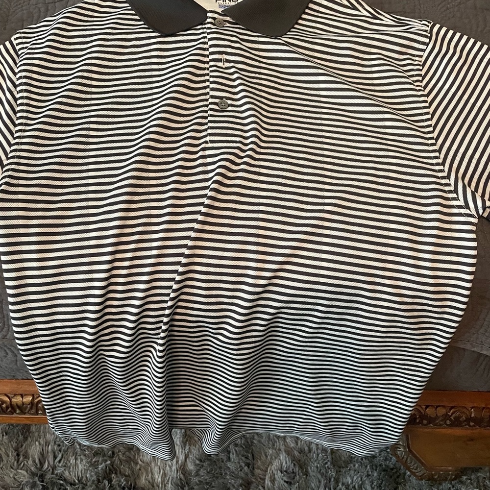 Black and whipping golf polo.
